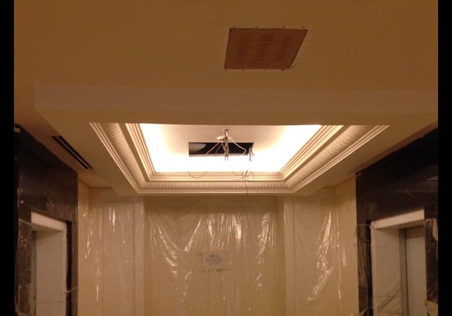 Primary guest area with Amina LFi2T invisible speakers blended into the architecture, delivering soft, evenly distributed background music without any visible hardware.