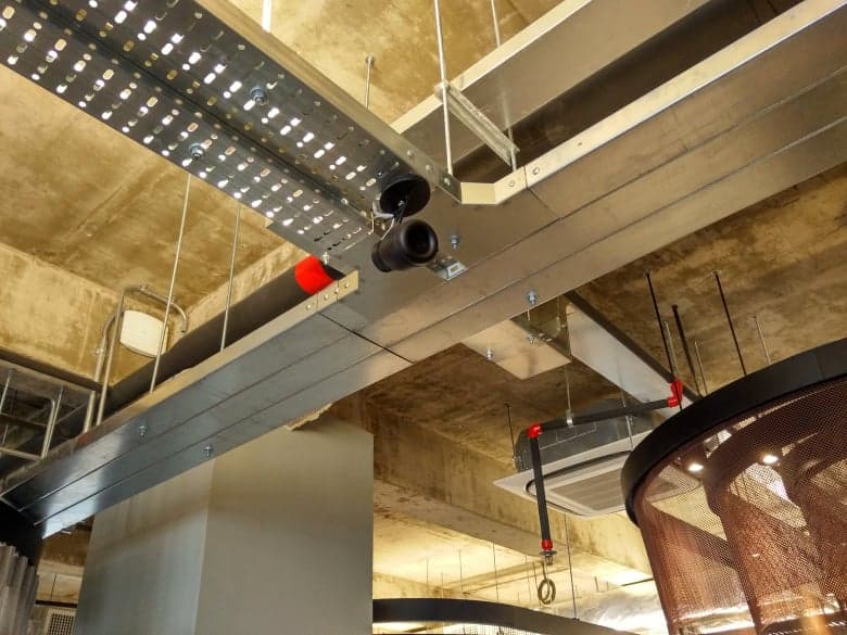 Uniform tonal balance across spaces for a cohesive building experience.