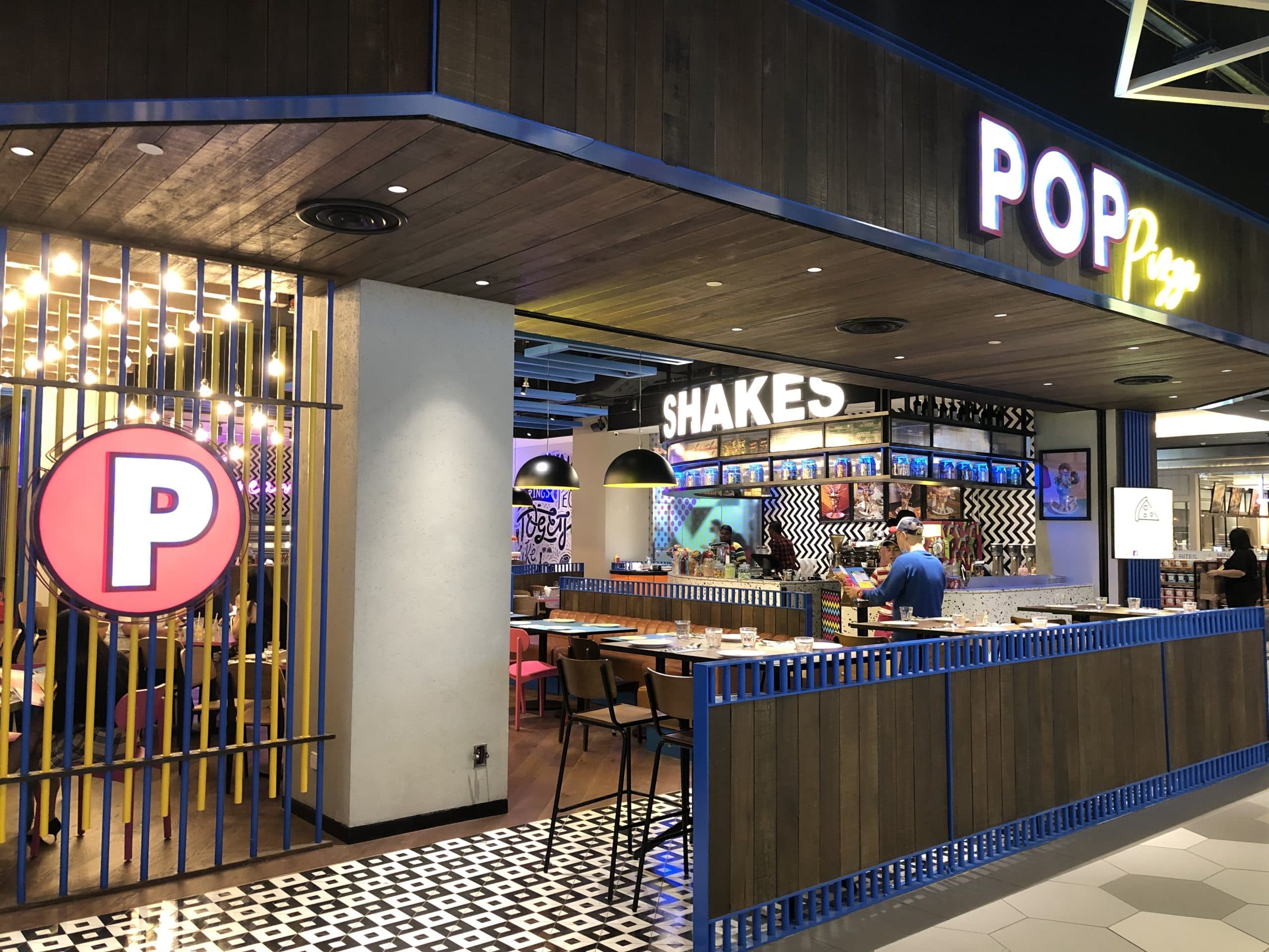 Feature wall and neon zone where audio and lighting are balanced to feel energetic for photos and socials, without becoming harsh or fatiguing.